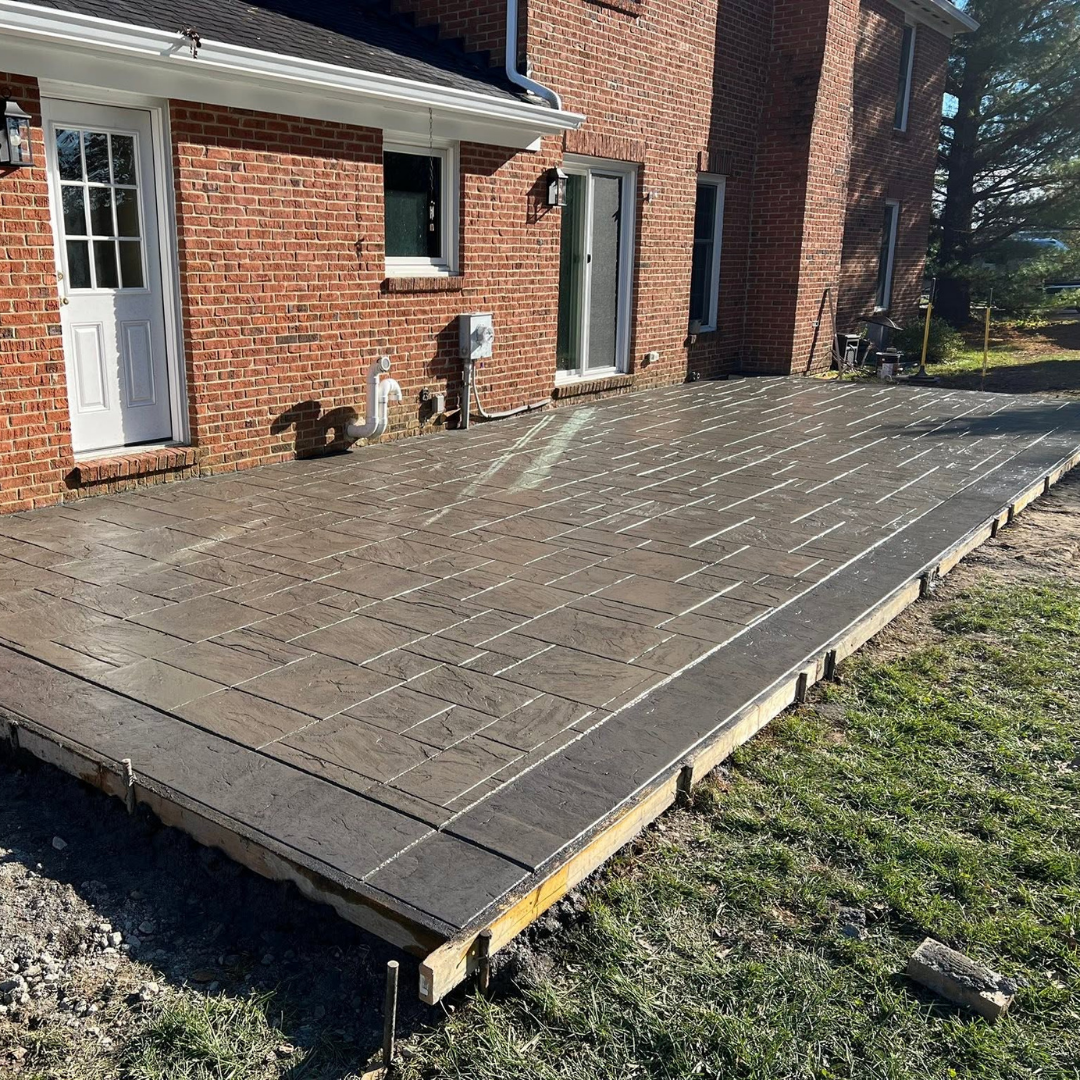 Replace your old wood deck with a stamped concrete patio