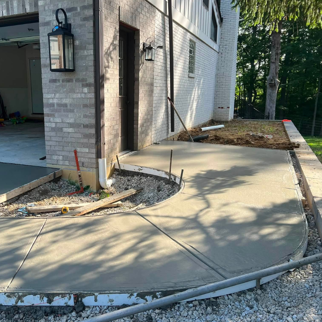Image of concrete walkway leading to the side entrance of the garage