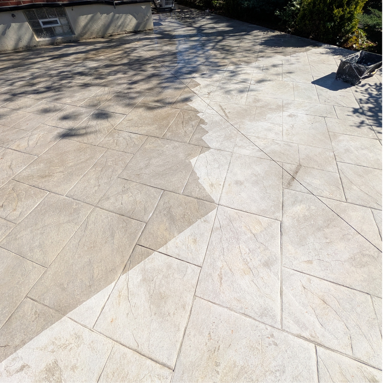 Faded stamped concrete patio before and after resealing in Cincinnati by Huff Concrete